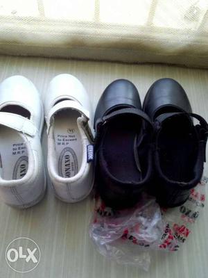 Two pairs of school stickering shoes black and