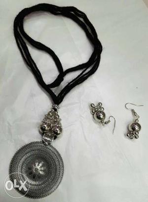 Black Necklace With Silver Pendant And Pair Of Silver