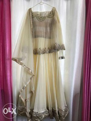 Desighner pohchu style cream colour long gown 2 hours used