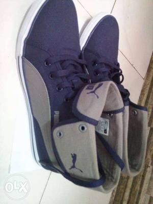 Pair Of Blue-and-gray Puma High-top Sneakers