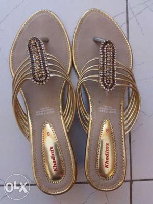 Pair Of Gray-and-gold-color Sandals