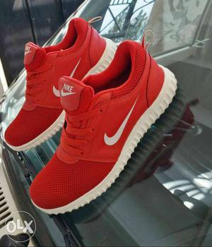 Pair Of Red Nike Low-top Sneakers