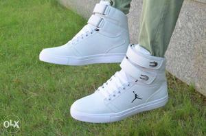 Pair Of White Air Jordan High-top Shoes