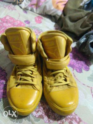 Pair Of Yellow Puma Leather High Top Shoes