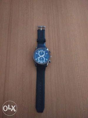 Round Blue Faced Chronograph Watch With Black Strap