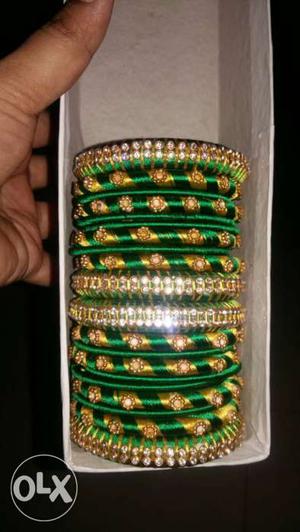 Set Of Green And Gold Silk Threaded Bangles