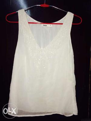 White cutsleeve top with sequence work