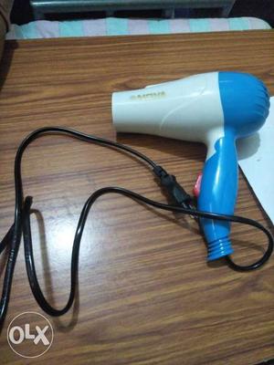 Women's White And Blue Hair Blower contact..