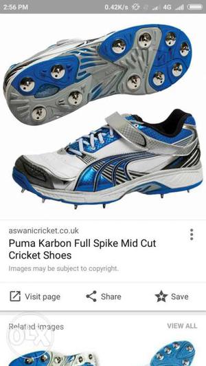 Black-white-blue Puma Karbon Full Spike Mid Cut Cricket