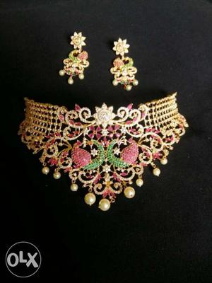 Gold And Pink Bib Necklace And Pair Of Earrings