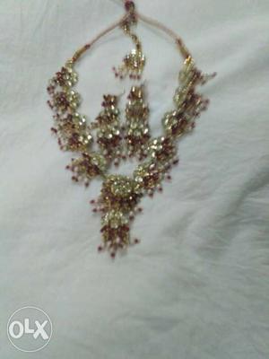Gold And Silver Necklace And Pair Of Earrings
