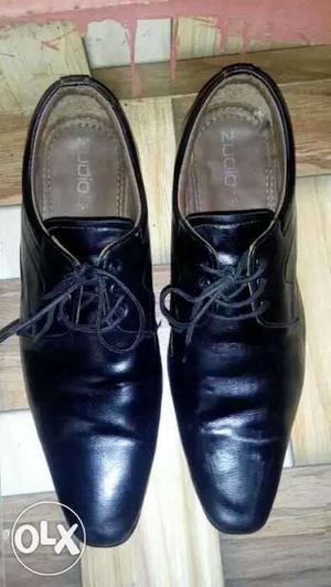 Pair Of Black Leather Oxford Shoes