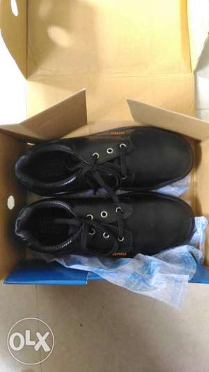 Pair Of Black Leather Shoes In Box