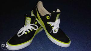 Pair Of Black-and-green Puma Low-top Sneakers