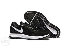 Pair Of Black-and-white Nike Shoes
