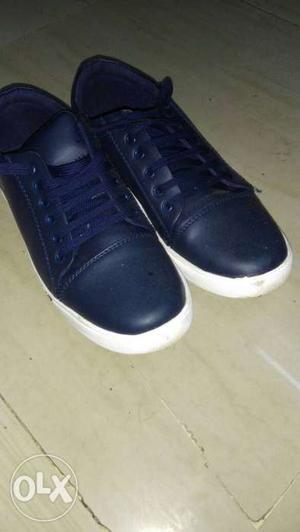 Pair Of Blue Leather Sneakers