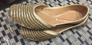 Pair Of Gold Beaded Flat Shoes