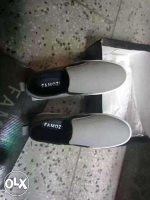 Pair Of Gray Famoz Slip On Shoes