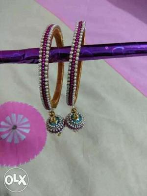 Pair Of Purple And White Beaded Bracelets