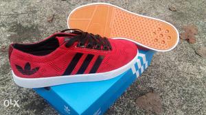 Pair Of Red-and-black Adidas Low Top Sneakers