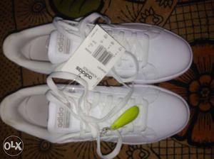 Pair Of White Adidas Shoes