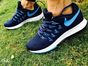 Pair Of White-black-and-blue Nike Sneaker