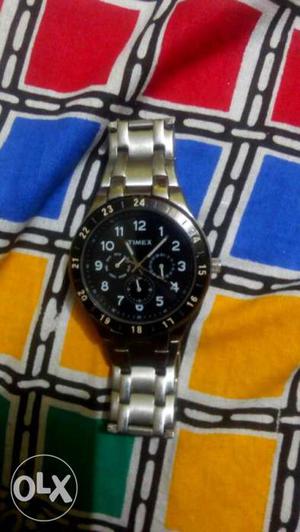 Round Framed Black Timex Chronograph Watch With Silver Link