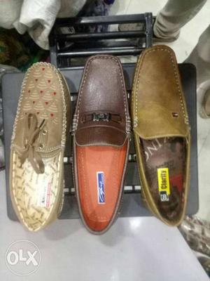 Three Unpaired Brown Loafers