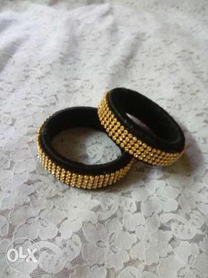 Two Gold And Black Beaded Band Rings