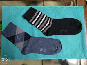 Two paired Black,gray, And White Arrow Socks