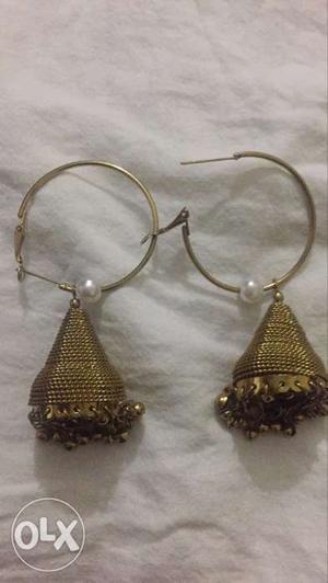 Two tikkas and one earring pair