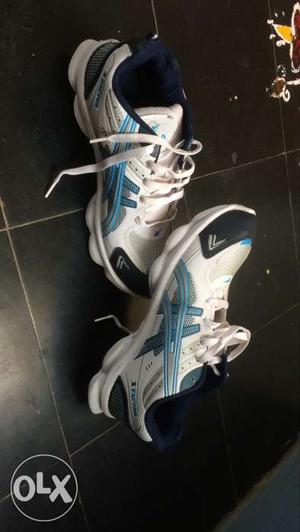 White-and-blue Asics Running Shoes