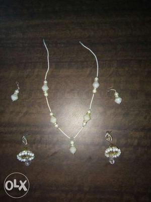 Women's Two Pair Of Gold Dangling Earrings And White Beaded