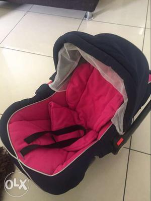 Baby's Black And Purple Car Seat Carrier