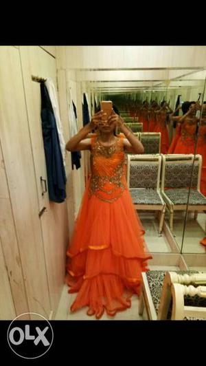 Orange colour long gown..very pretty one.. new