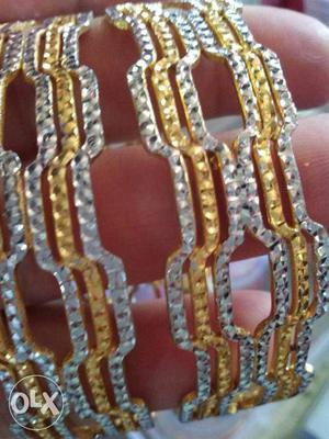 Women's Two Silver And Gold Bangles