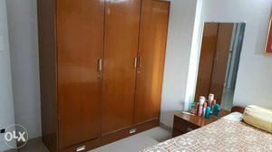 3 door wooden cupboard with sufficient storage