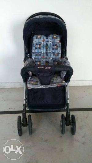 Black, Blue, And White Fabric Stroller