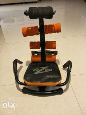 Orange And Black AB Zone exercise machine