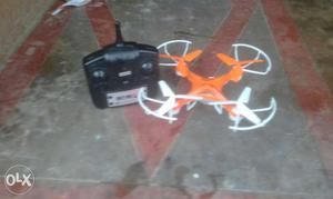 Orange And White Quadcopter With Remote Control