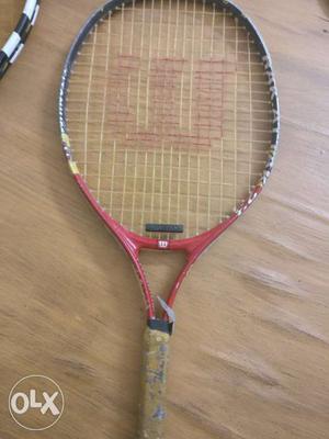Red And White Wilson Tennis Racket