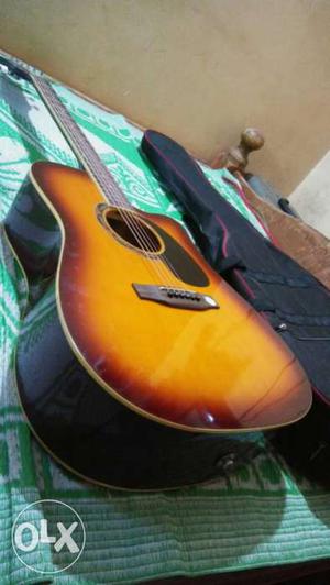 Sunburst Acoustic Guitar With Black Case. Gb&a its new one