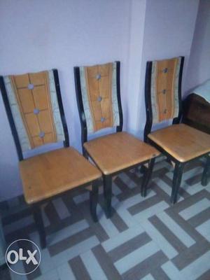 Three Brown-and-black Wooden Chairs