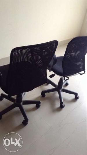 Two Black Rolling Armchairs