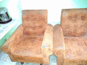 Two Brown Floral Padded Rolled-arm Sofa Chairs