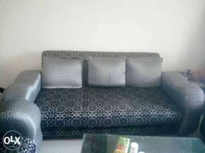 Black And Gray Floral Sofa With Three Pillows