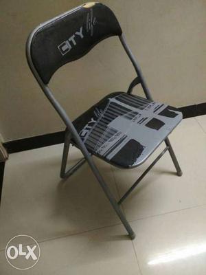 Black And Gray Metal Folding Chair