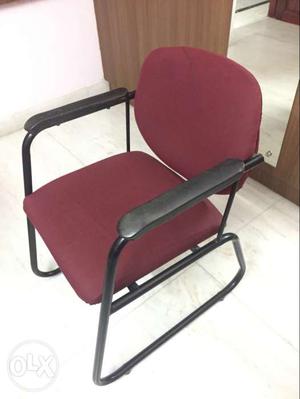 Black Metal Frame And Red Padded Armchair