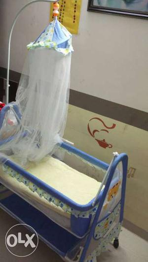 Cradle. Hardly used. Looks brand new, with mosquito net