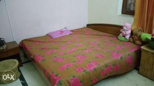 Double bed with mattress and side tables
